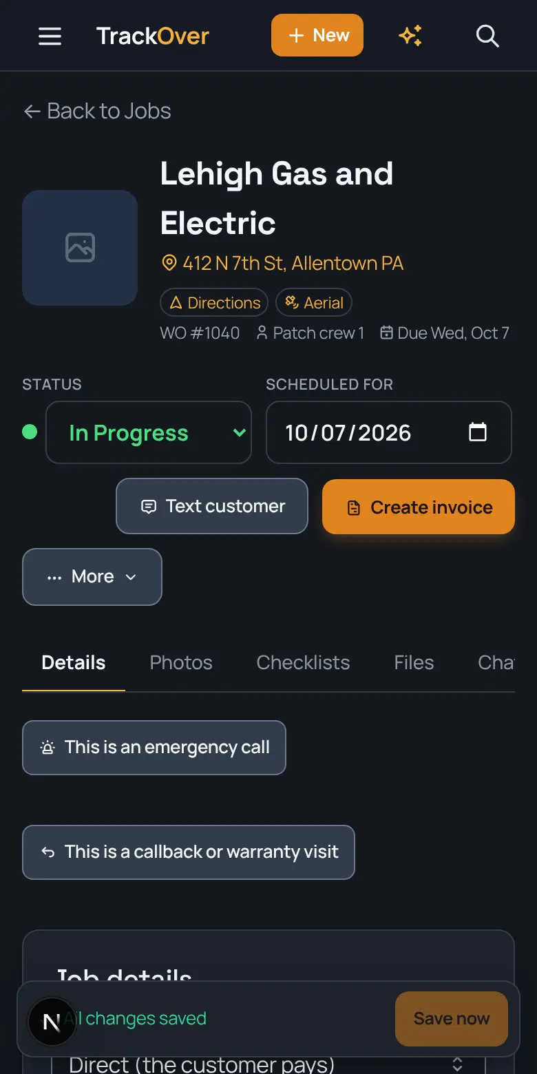 A TrackOver job page on a phone: customer, address, status and the invoice button