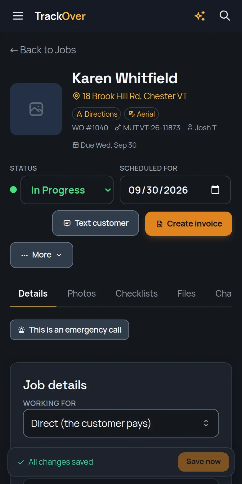 A TrackOver job page on a phone: customer, address, status and the invoice button